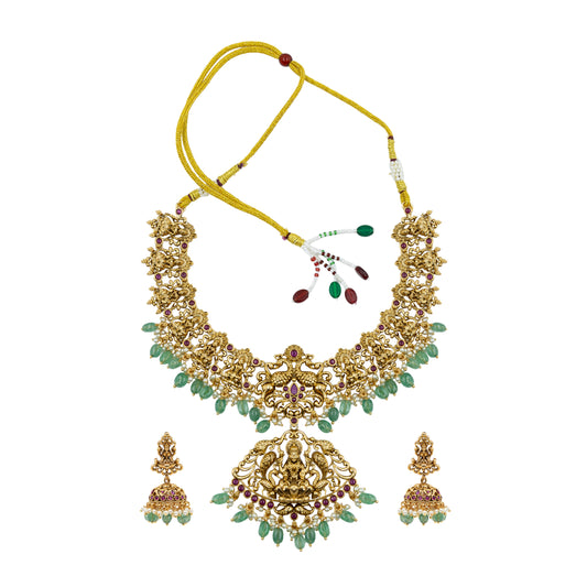 Lakshmi Gold necklace with green stones and matching earrings on a white background