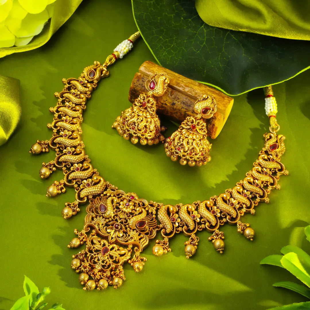 Peacock Temple Gold necklace Set on a green leaf Background