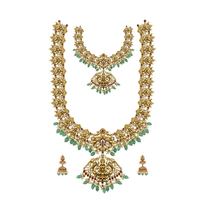 Lakshmi Gold necklace Set ewith green gemstones on a white background